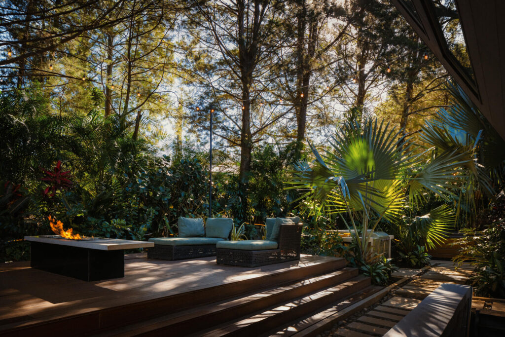 Garden path leading to the glass architecture of Alianz Loft