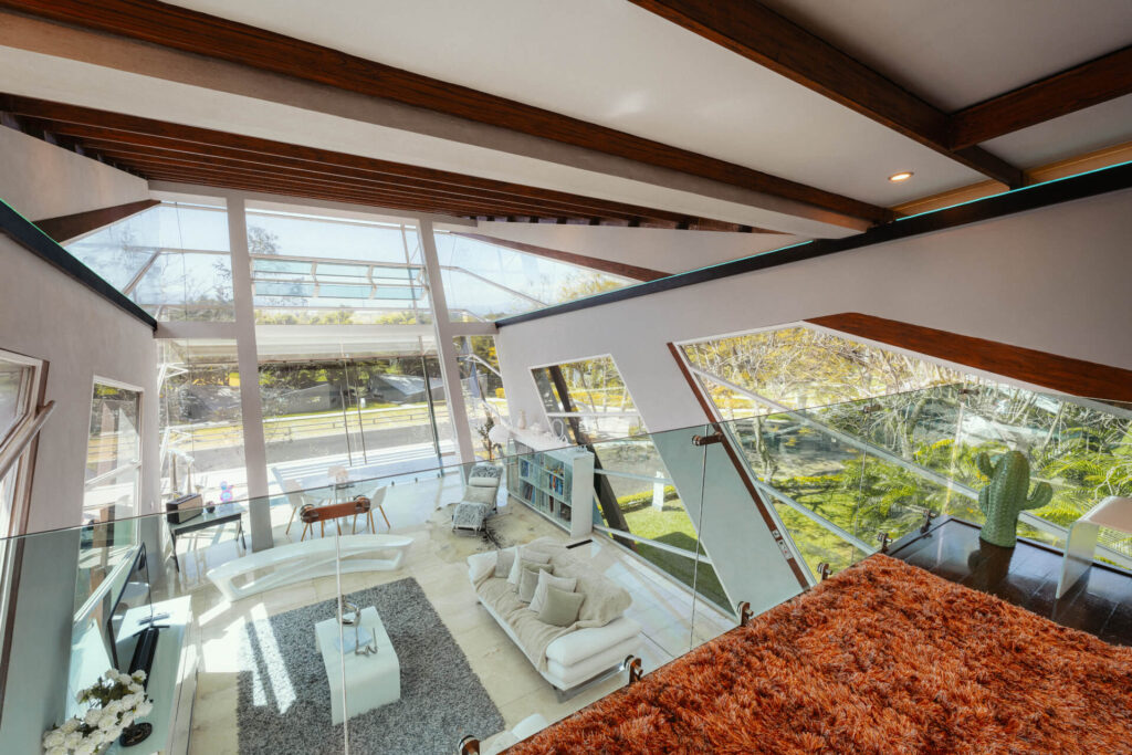 Glass corner of the loft framing the landscape