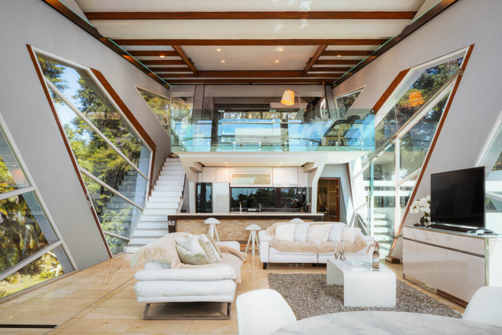 Living area with sofa, plant and warm evening light