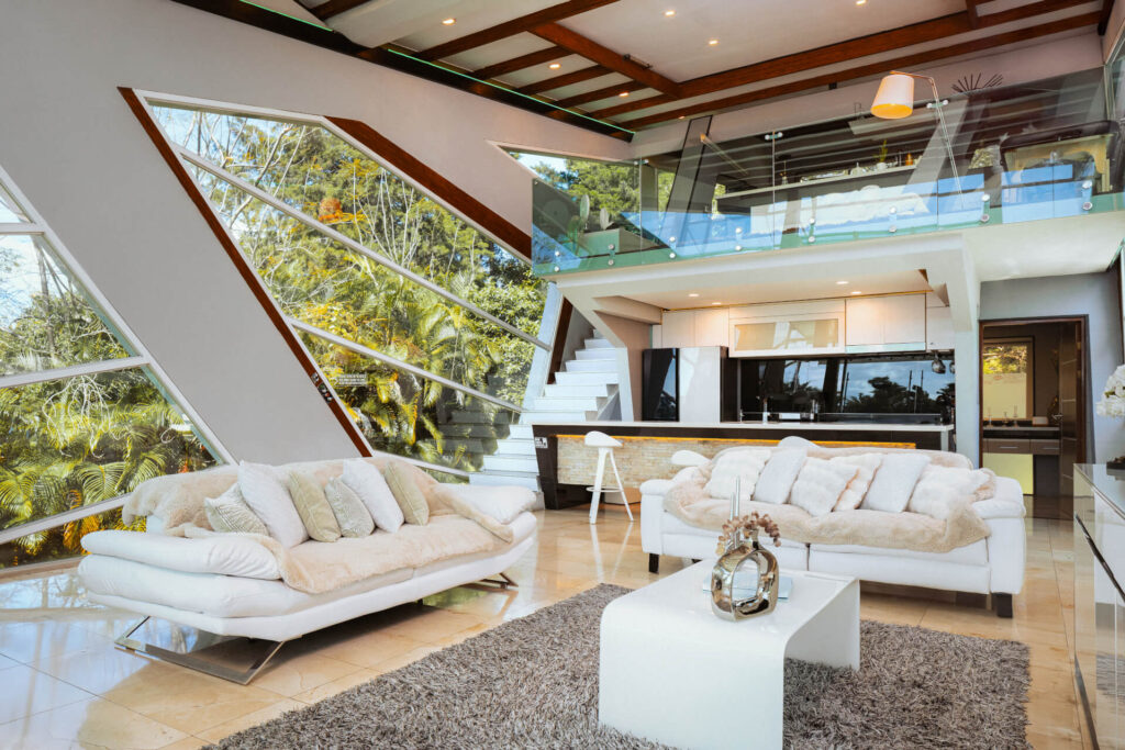 Media and living room with angular glass architecture