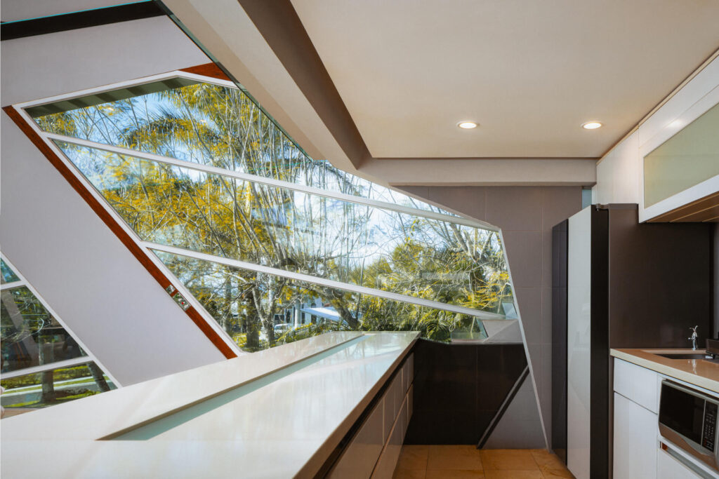 Terrace with glass railing overlooking the valley