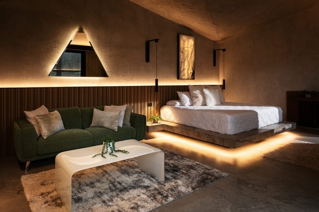 Serene bedroom inside a Nebulae Module — warm wood, concealed lighting and a calm, restorative atmosphere