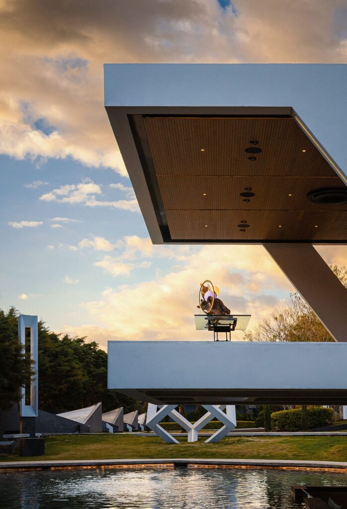 Nebulae Yogadeck at dusk surrounded by gardens
