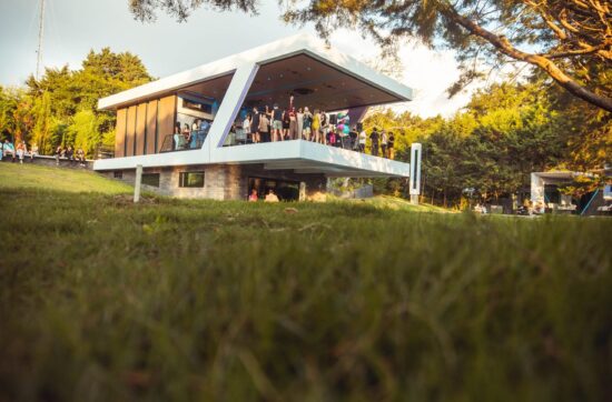 Nebulae Yogadeck open-air shala glowing at golden hour in Heredia, Costa Rica