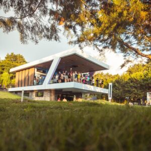 Nebulae Yogadeck open-air shala glowing at golden hour in Heredia, Costa Rica