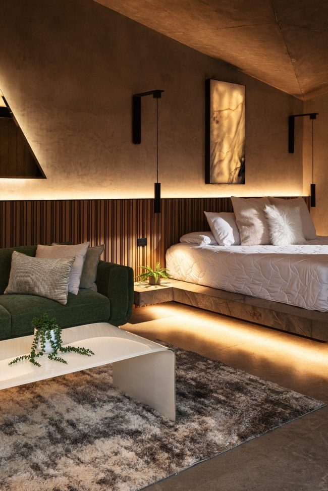 Serene bedroom inside a Nebulae Module — warm wood, concealed lighting and a calm, restorative atmosphere
