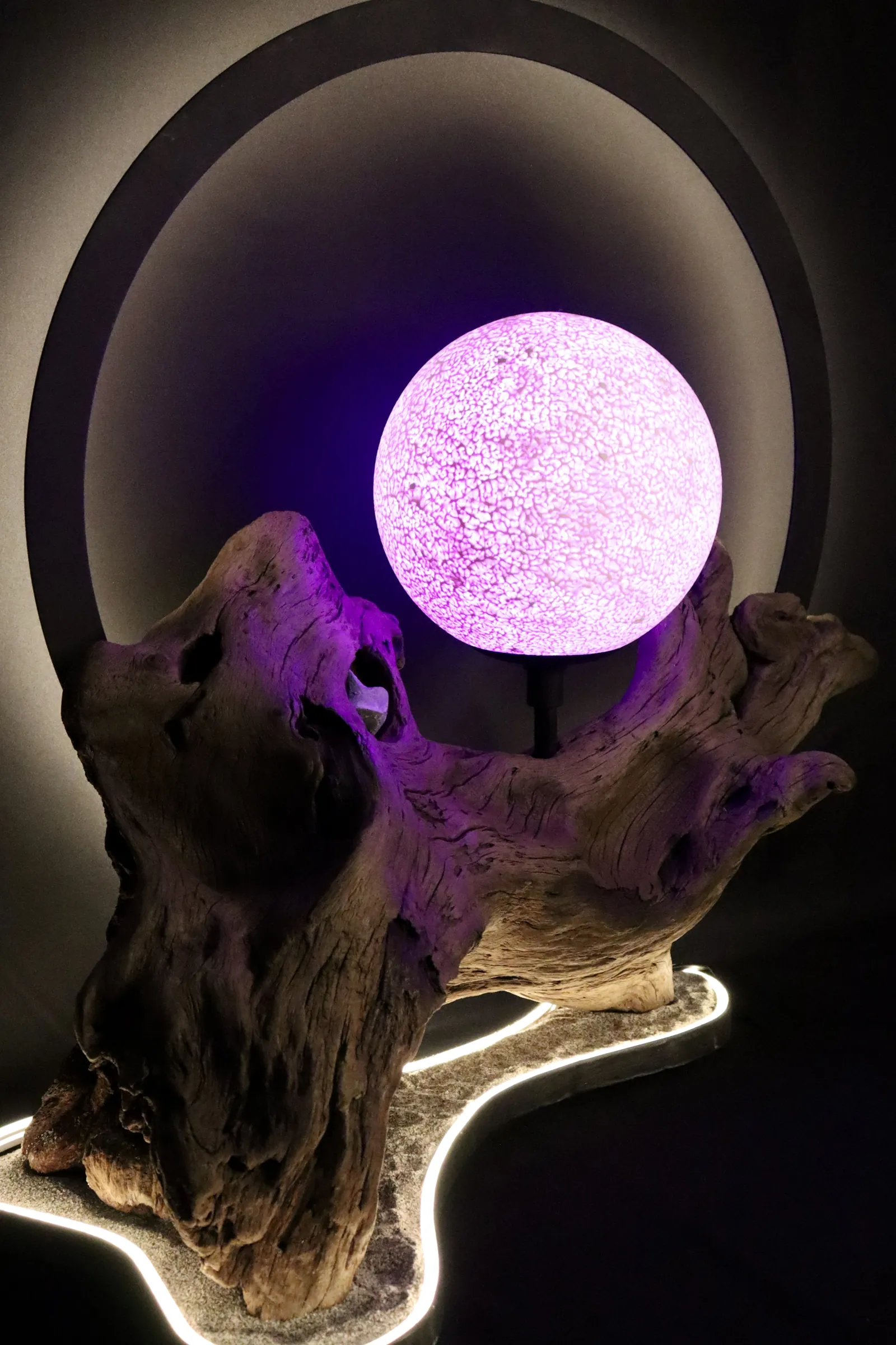 Halo in its violet atmosphere — amethyst-toned moon and ring