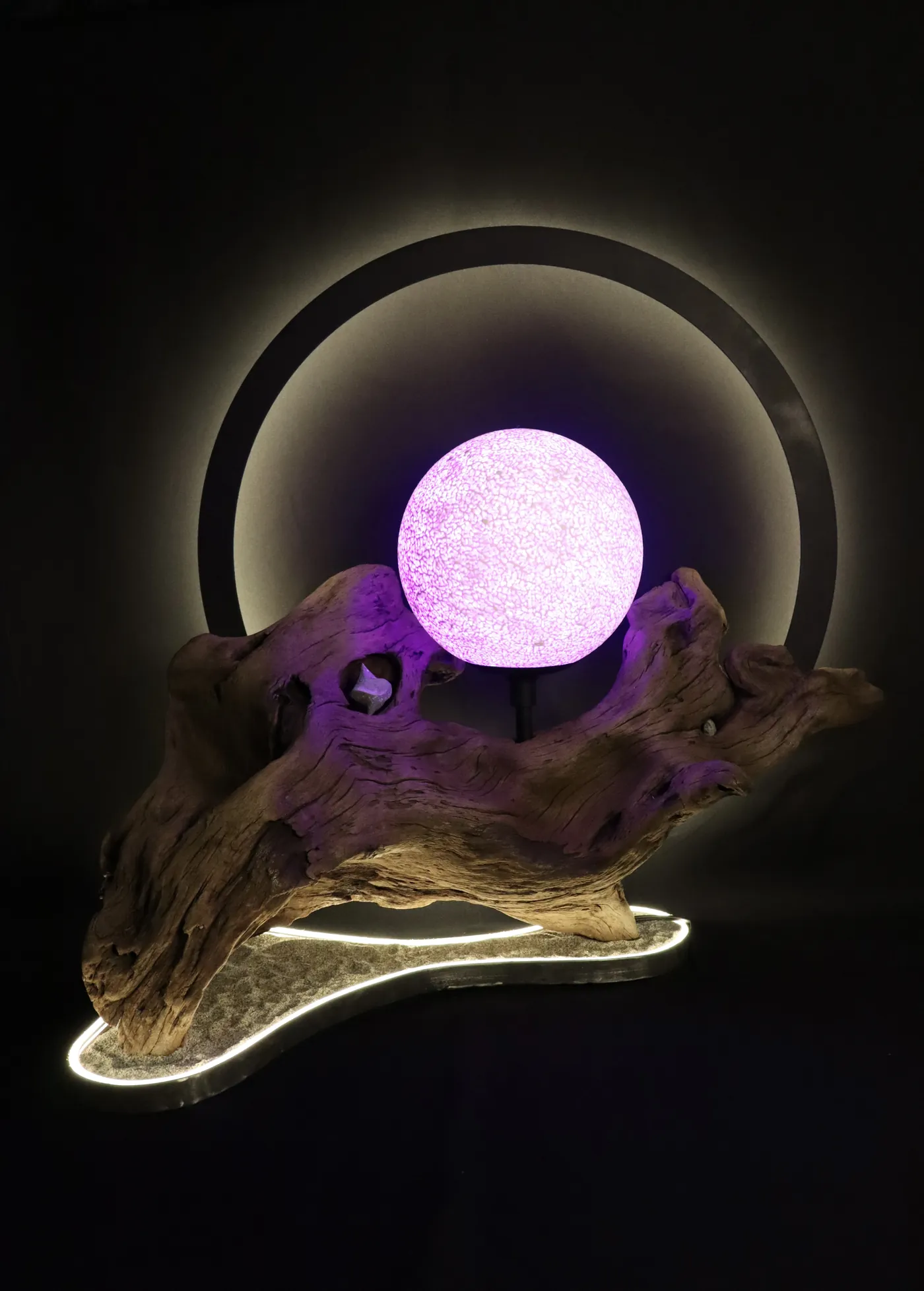 Halo with violet moon, its sand base glowing in a ring of light